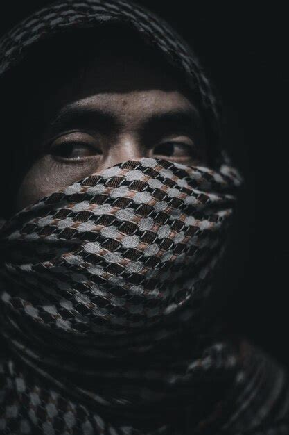 Premium Photo Close Up Portrait Of Man Wearing Mask Against Black