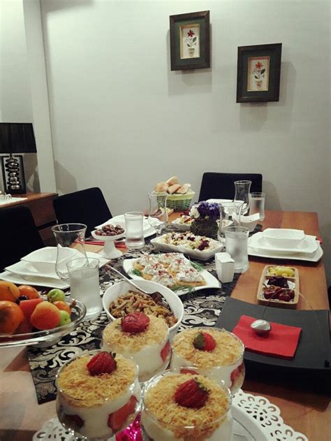 A Dining Room Table Is Set With Desserts And Fruit