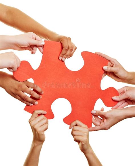 Hands Holding Jigsaw Puzzle As Teamwork Concept Stock Image Image Of