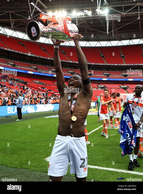 Blackpool S Bright Osayi Samuel Celebrates With The Trophy After His