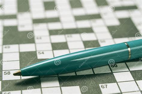 Ballpoint Pen Is Lying On Piece With Crossword Puzzlehobby Concept And