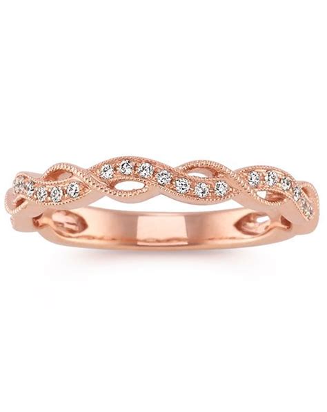 A Rose Gold Wedding Band With Diamonds