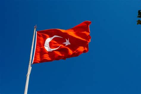 Premium Photo Turkish National Flag With White Star And Moon In Sky