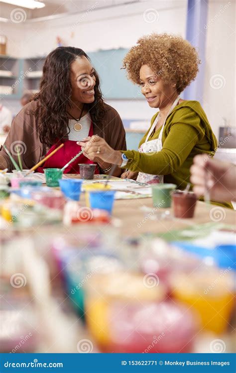 Two Mature Women Attending Art Class In Community Centre Together Stock Image Image Of Club