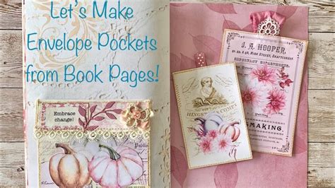 An Open Book With Pink Flowers On It And Some Tags Attached To The