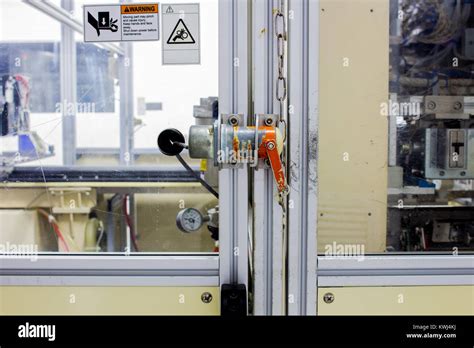 The safety plug on door of machine machinery used in work time Stock Photo - Alamy