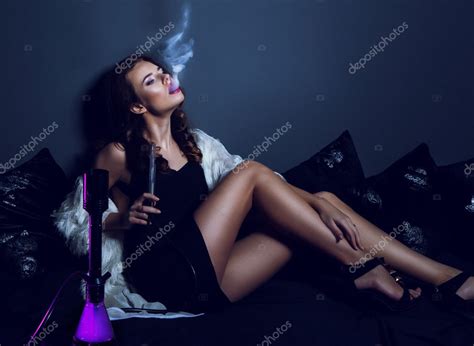 Sexy Glamour Woman In Club Dress With Long Legs Smoking Hookah Stock