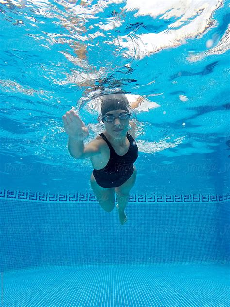 Woman Swimming In A Pool By Stocksy Contributor ACALU Studio Stocksy