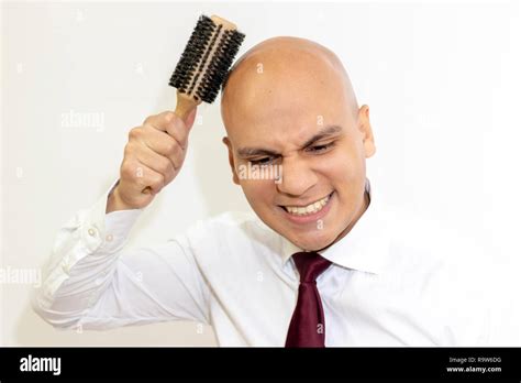 Bald Man Combing His Hair Stock Photo Alamy