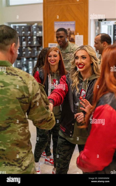 Shannon Currie A Tampa Bay Buccaneers Cheerleader Shakes Hands With A