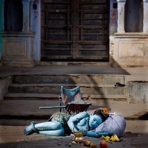 Two People Laying On The Ground Next To Each Other In Front Of An Old