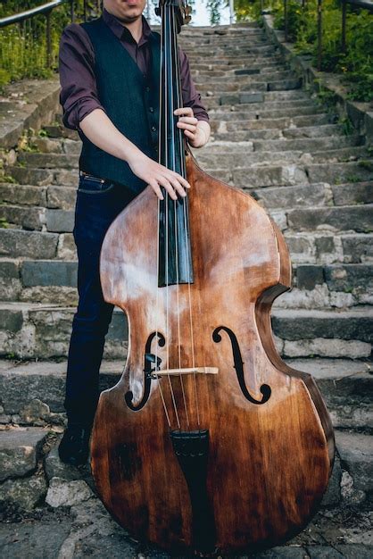 Premium Photo View Of Musician Playing Contrabass At The Street