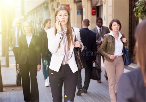 People In Formal Wear Walking Down Street In City Stock Photo Image