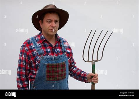 Farmer With Pitchfork Stock Photo Alamy