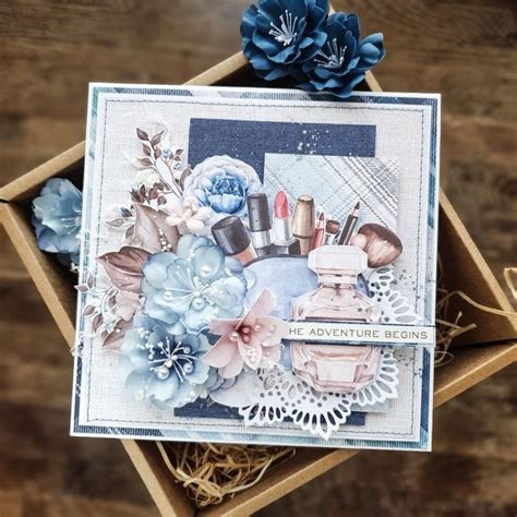 An Open Box With Some Flowers And Cosmetics In It On Top Of A Wooden Table