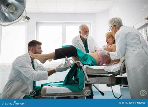 Woman Giving Birth In Hospital With Medical Team Stock Image Image Of