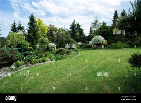 Beautiful spring garden design Stock Photo - Alamy