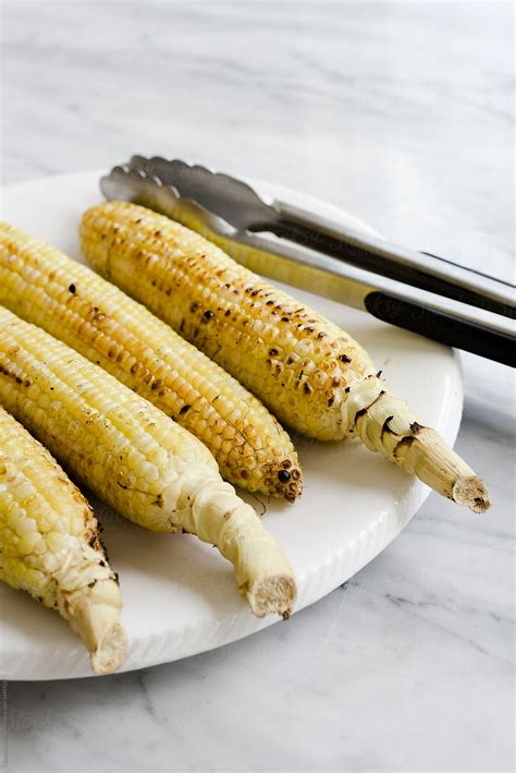 "Grilled Ears Of Corn" by Stocksy Contributor "CWP, LLC" - Stocksy