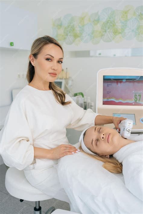 Premium Photo Vertical Portrait Of Beautician Doctor Using Laser