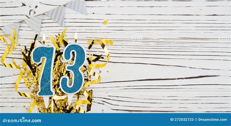 Number 73 Blue Celebration Candle On White Wooden Background With