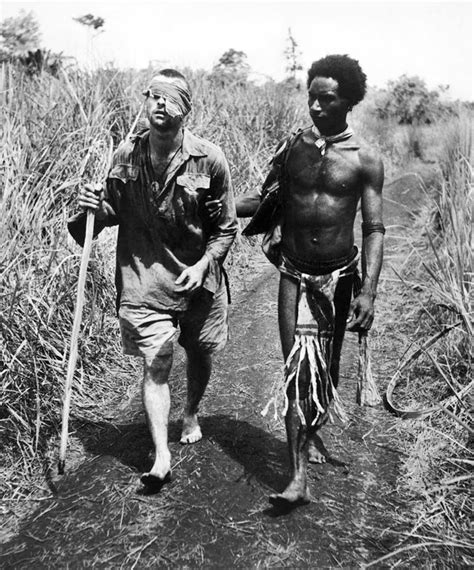 A Papuan Fuzzy Wuzzy Angel guiding an injured Australian soldier home, 1942