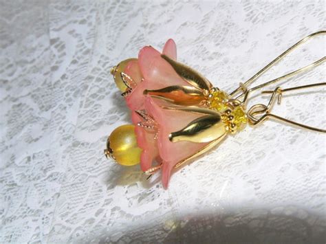 Hand Dyed Papaya And Yellow Lucite Flower Earrings With Gold