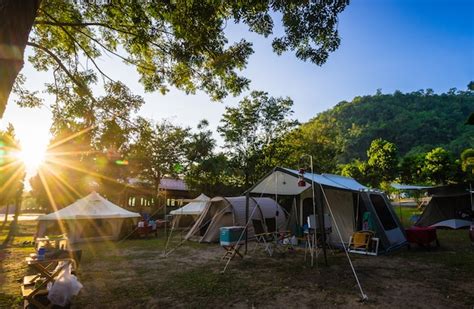 Premium Photo | Camping and tent in nature park with sunrise