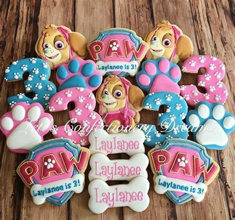 Paw Patrol Cookies Are Arranged In The Shape Of Letters And Paws On Top