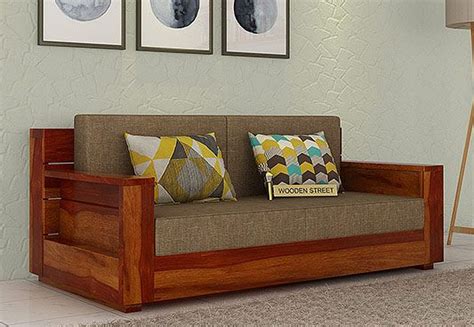 The Marriott 2 Seater Wooden Sofa In Dashing Honey Finish Is An