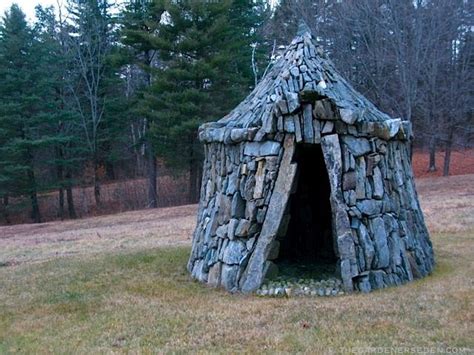 A Small Stone Structure In The Middle Of A Field