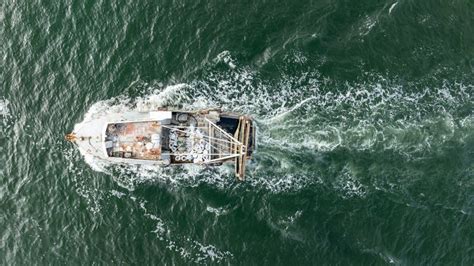 Aerial View Of Trawler Vessel Fishing Boat Trauler With Sacks Full Of