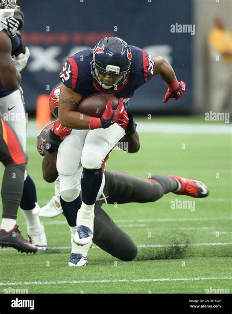 Houston Texans Running Back Chris Polk 22 Is Tackled By Tampa Bay Buccaneers Outside