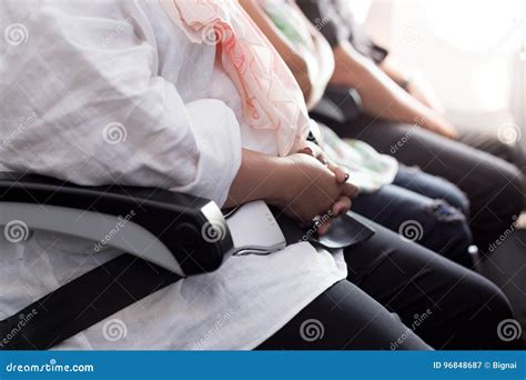 Safety Concept Passenger Fasten Seat Belt At Seat On Airplane Stock Image Image Of Hand Blond