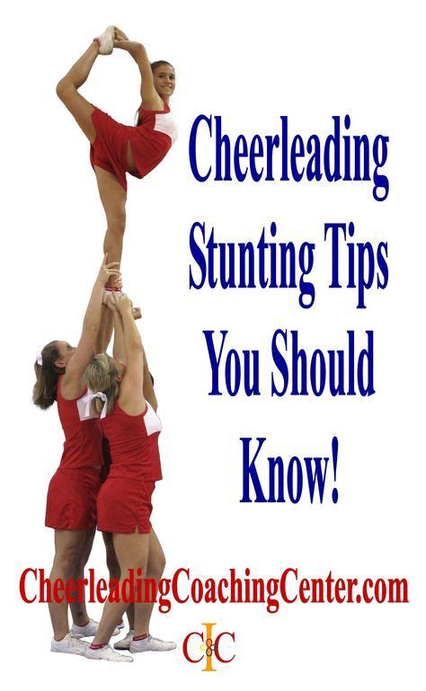 Three Cheerleaders Are Standing In The Air With Their Hands On Top Of