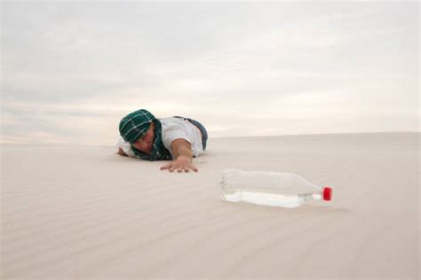 Thirsty Desert Crawling Men Stock Photos, Pictures & Royalty-Free Images - iStock