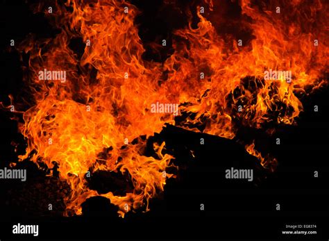 real flames isolated  black stock photo alamy