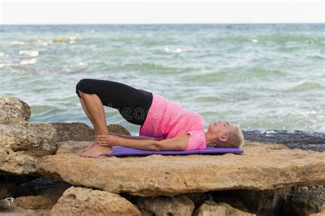 Woman Doing Yoga Exercises At The Beach Stock Image Image Of