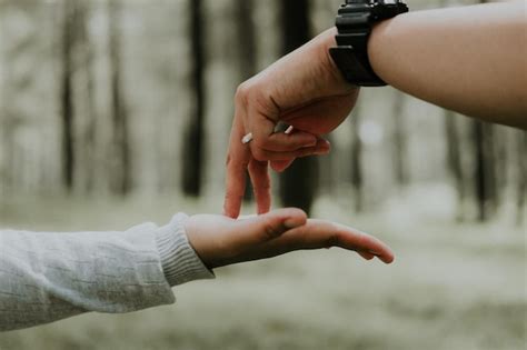 Premium Photo Cropped Hands Of People Against Trees