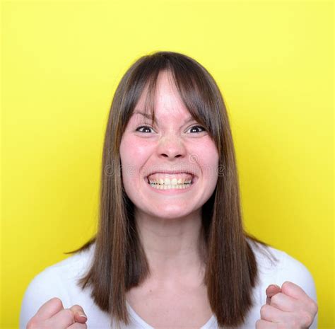 Portrait Of Girl With Funny Face Against Red Background Stock Image