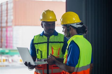 Manual Workers Working In Warehouse Talking About Job Workers Team