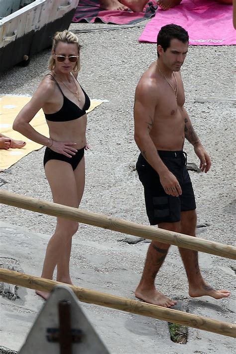 Robin Wright In Bikini And Clement Giraudet At A Beach In Capri