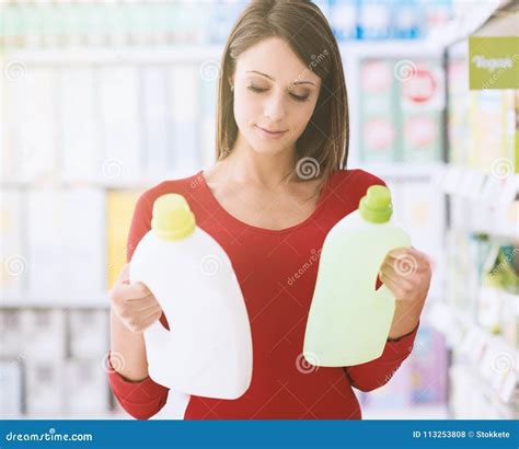 Woman comparing products stock photo. Image of labelling - 113253808