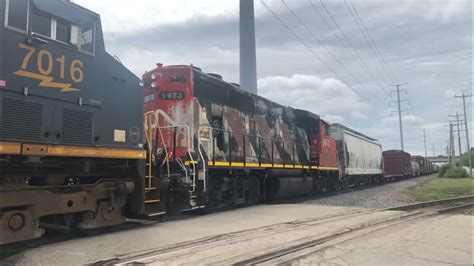 CSX #717 w/ CSX #7016 & CN #9673 on A447.91 - YouTube