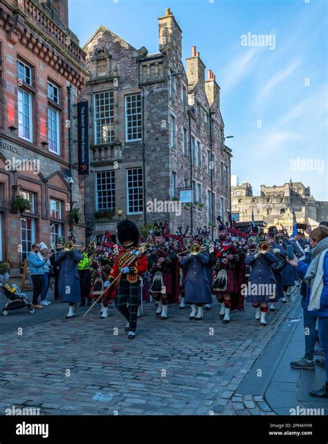 Pipe Band Parade Marching Out Of Edinburgh Castle Onto The Royal Mile