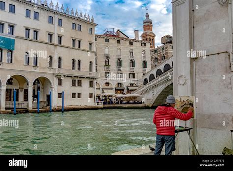 An Artist Painting A Picture Of The Rialto Bridge In Venice Italy The