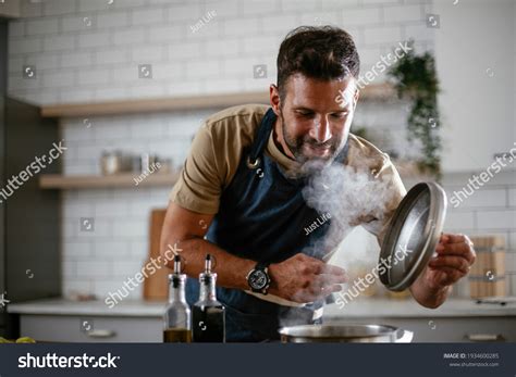 150412 Man Cooking Dinner Images Stock Photos And Vectors Shutterstock