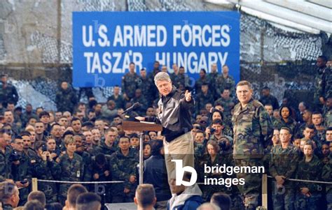 Image of US President Bill Clinton gestures as he gives a speech