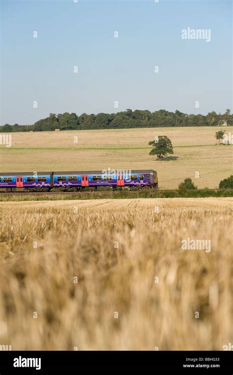 Passenger Train Class 319 In First Capital Connect Livery Speeding