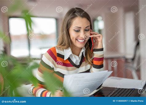 Happy Beautiful Business Woman Talking On The Phone At The Office Stock