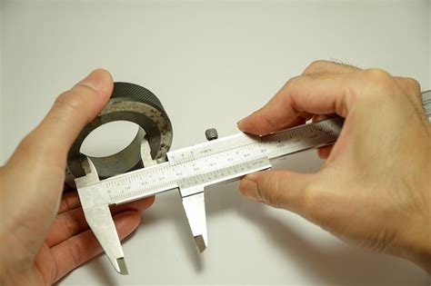 Premium Photo Engineer S Hand Uses A Vernier Caliper That Is Checked